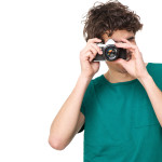 Young Man Taking Picture with Camera
